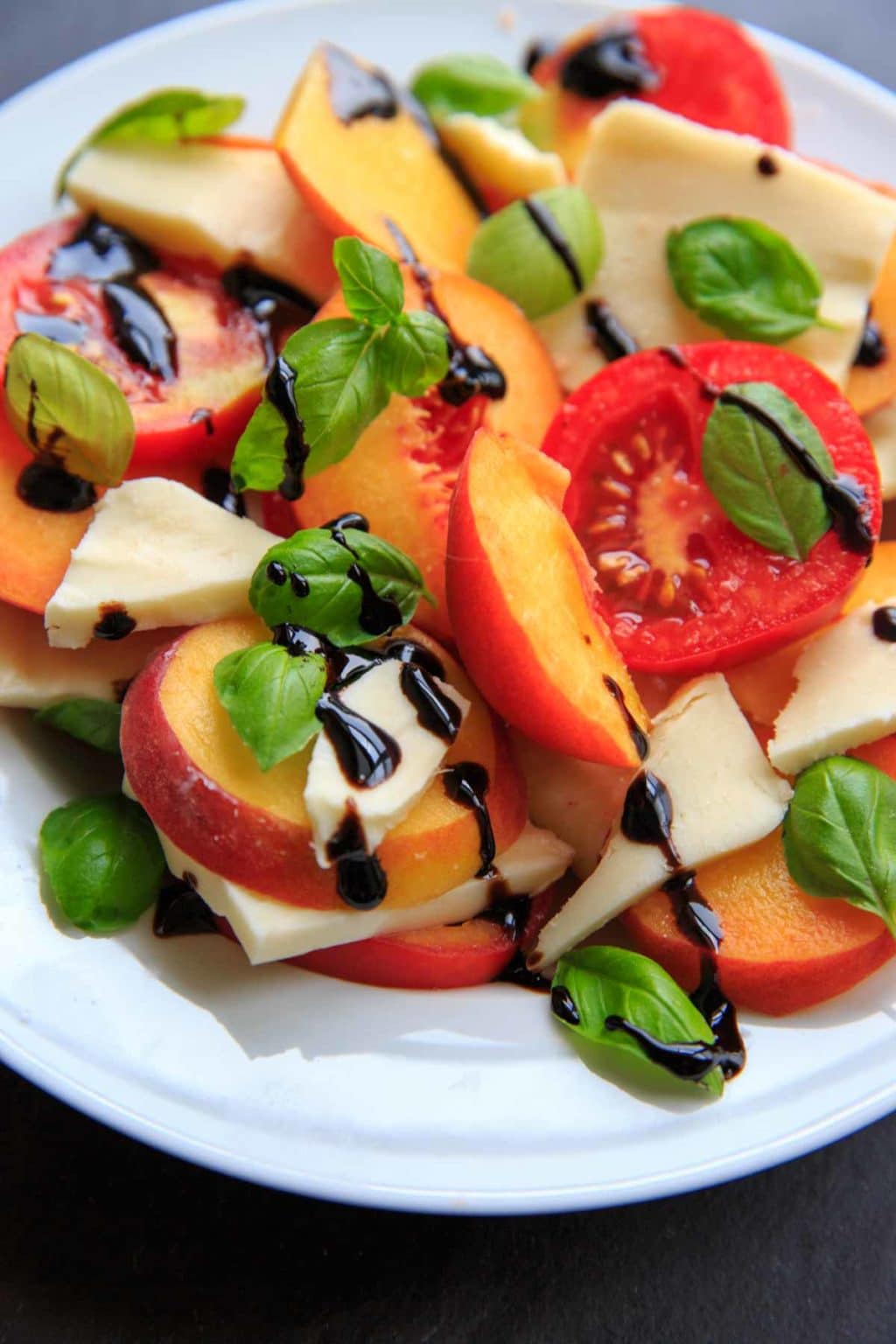 close-up view of peach caprese salad