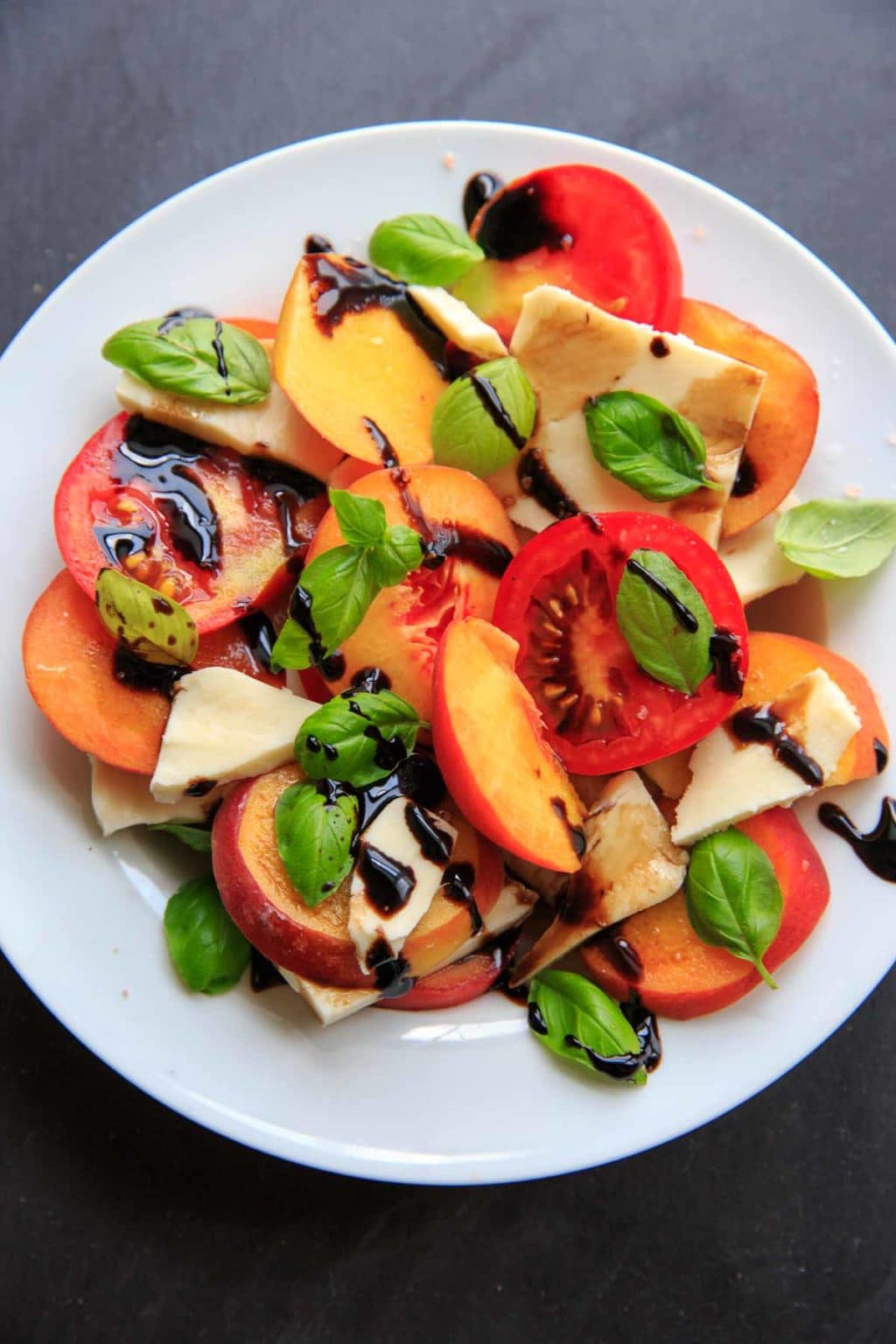 peach caprese salad with balsamic drizzle on top