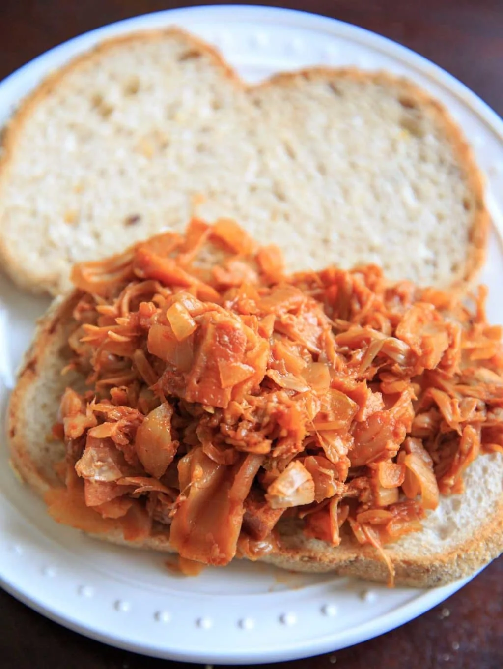 open-faced Pulled BBQ Jackfruit sandwich on white plate