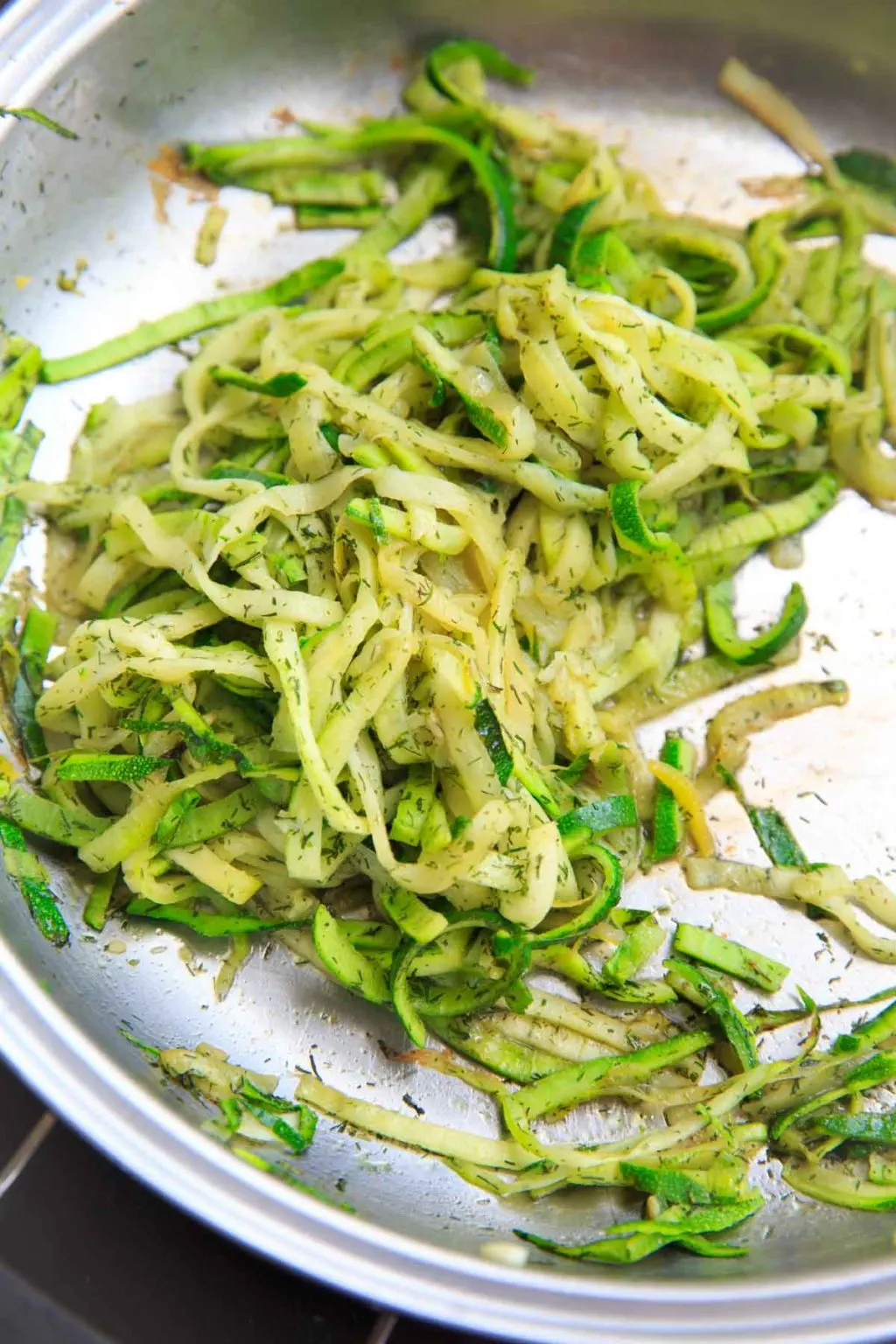 Cooked spiralized zucchini with dill