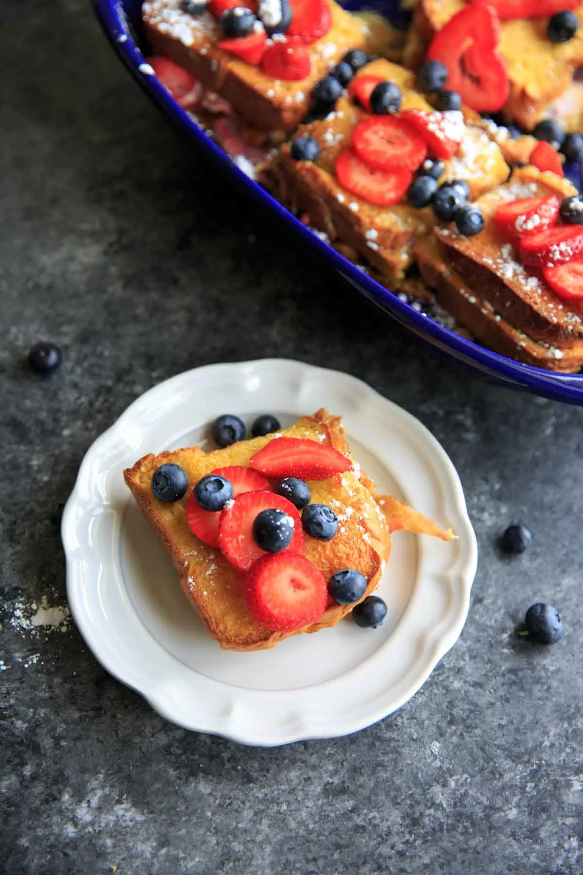 one piece of stuffed berry french toast on white plate