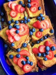 Summer Berry Stuffed French Toast Casserole Bake. Stuffed with cream cheese, fruit jam, strawberries and blueberries and topped with more berries! Serve with a sprinkle of powdered sugar and/or maple syrup if desired. Breakfast or brunch is served!