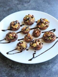 Chevre Stuffed Mushrooms with Sun-dried Tomatoes are an easy finger food or appetizer that is full of flavor! Option to mix it up with different flavors of goat cheese or sprinkle with herbs and balsamic vinegar.