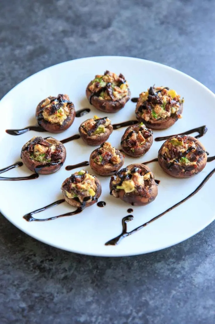 Chevre Stuffed Mushrooms with Sun-dried Tomatoes are an easy finger food or appetizer that is full of flavor! Option to mix it up with different flavors of goat cheese or sprinkle with herbs and balsamic vinegar.