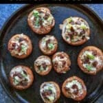 Chevre Stuffed Mushrooms with Sun-dried Tomatoes are an easy finger food or appetizer that is full of flavor! Option to mix it up with different flavors of goat cheese or sprinkle with herbs and balsamic vinegar.