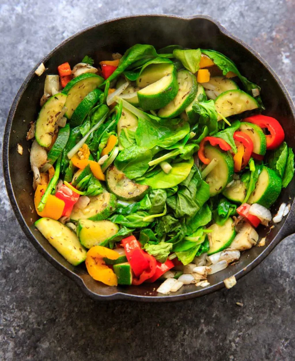 Sauteed vegetables with zucchini, onion, mini sweet peppers and spinach