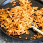 Coconut Flake "Bacon" - Coconut chips/flakes baked with soy sauce or tamari, maple syrup, liquid smoke and a touch of sriracha. Vegan bacon!