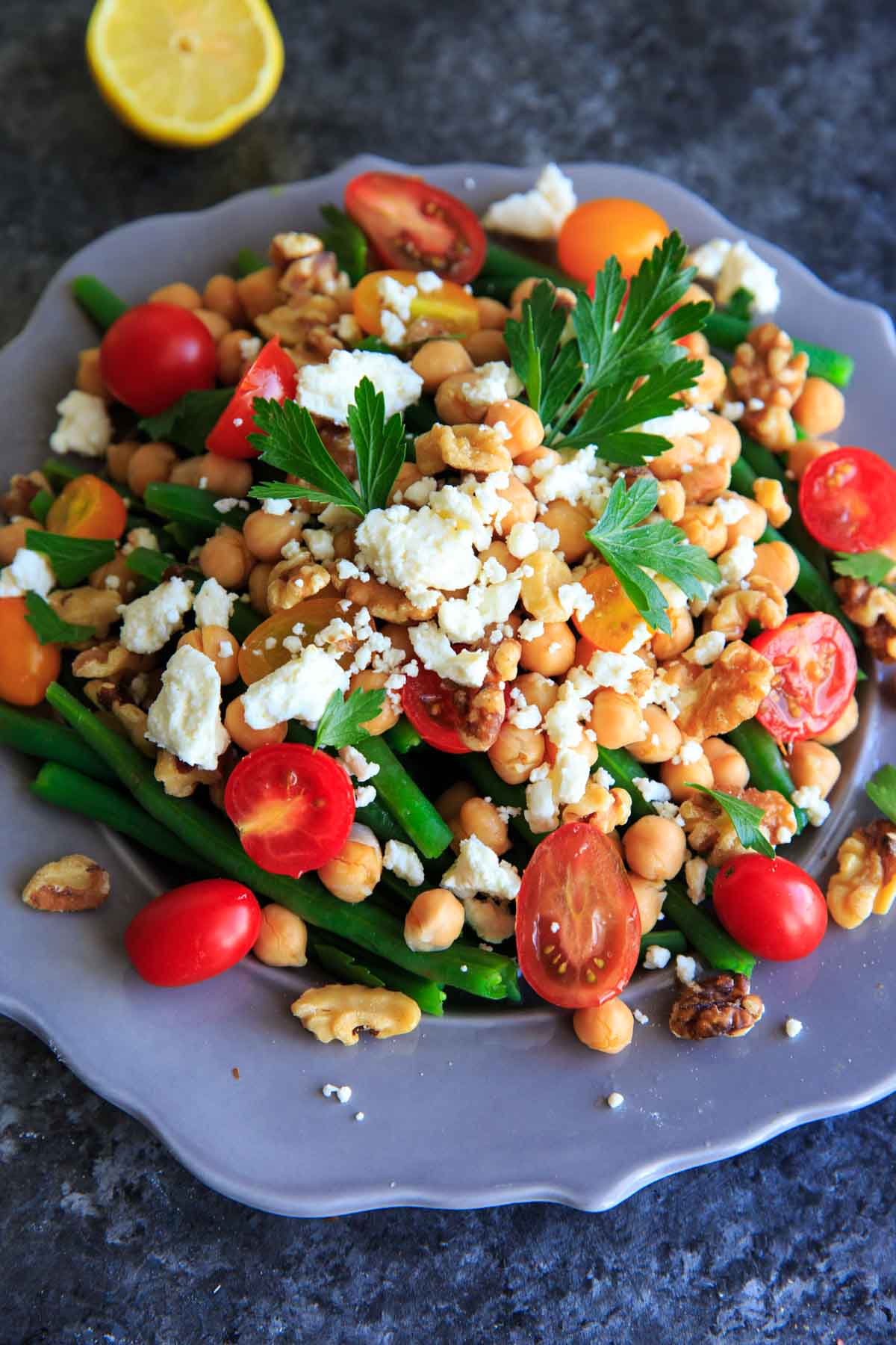 Green Bean Chickpea Salad with tomato, walnuts and feta. A great appetizer or side dish for dinners or holiday gatherings!