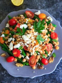 Green Bean Chickpea Salad with tomato, walnuts, feta cheese, parsley and lemon. A great appetizer or side dish for dinners or holiday gatherings!