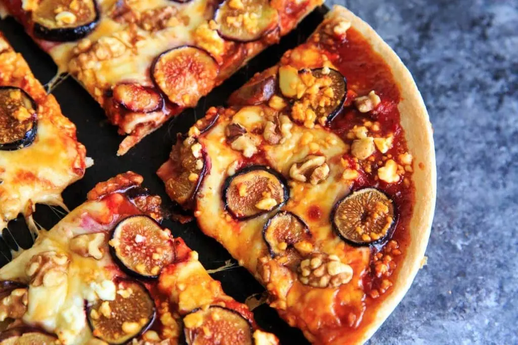 close up of a slice of homemade honey fig pizza