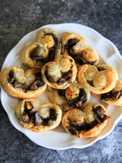 Savory Mushroom Palmiers - a savory version of the puff pastry treat that can be served as a delicious appetizer or side. Especially great for holidays or dinner parties!