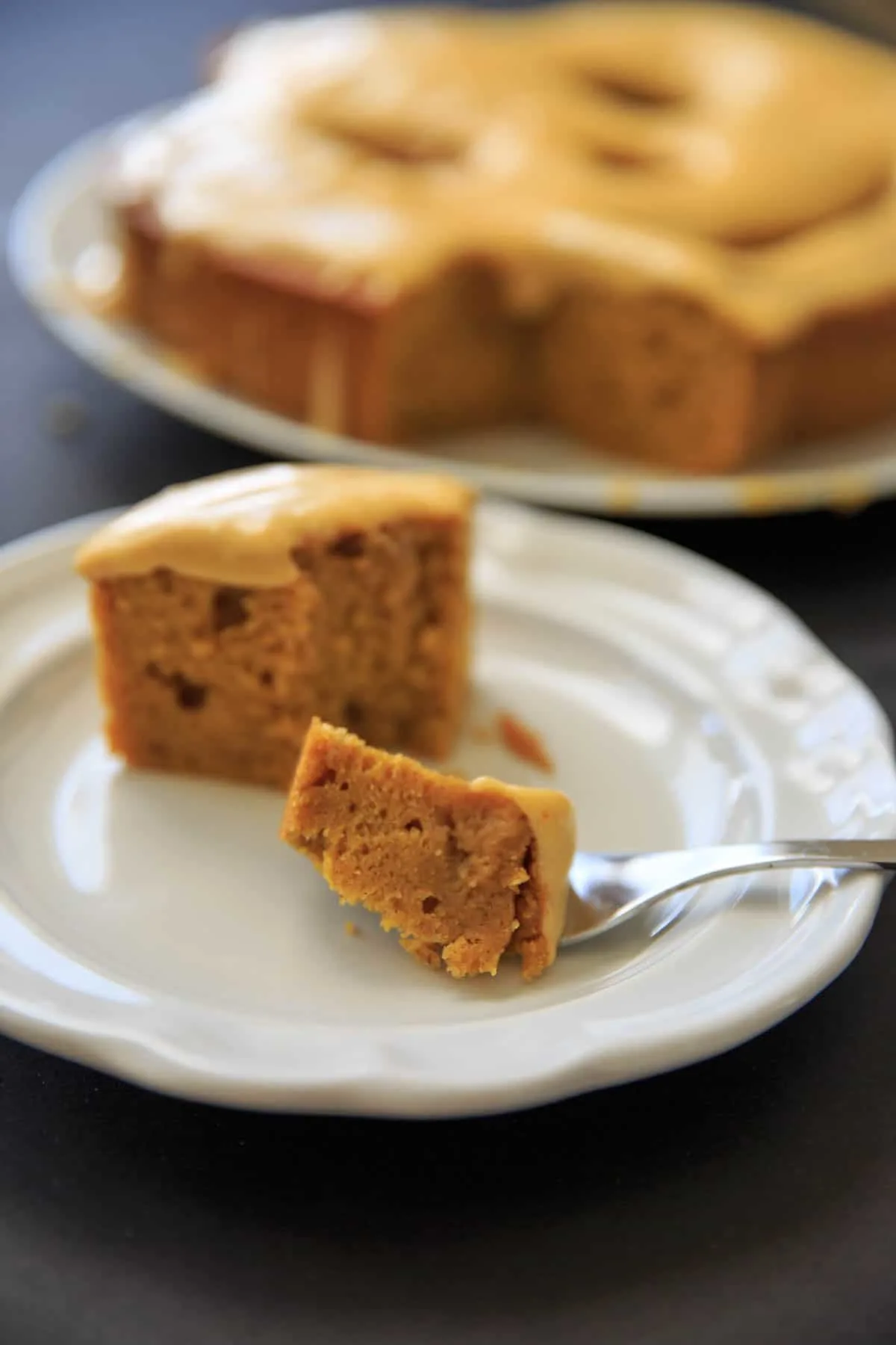 Piece of cake with bite on fork.