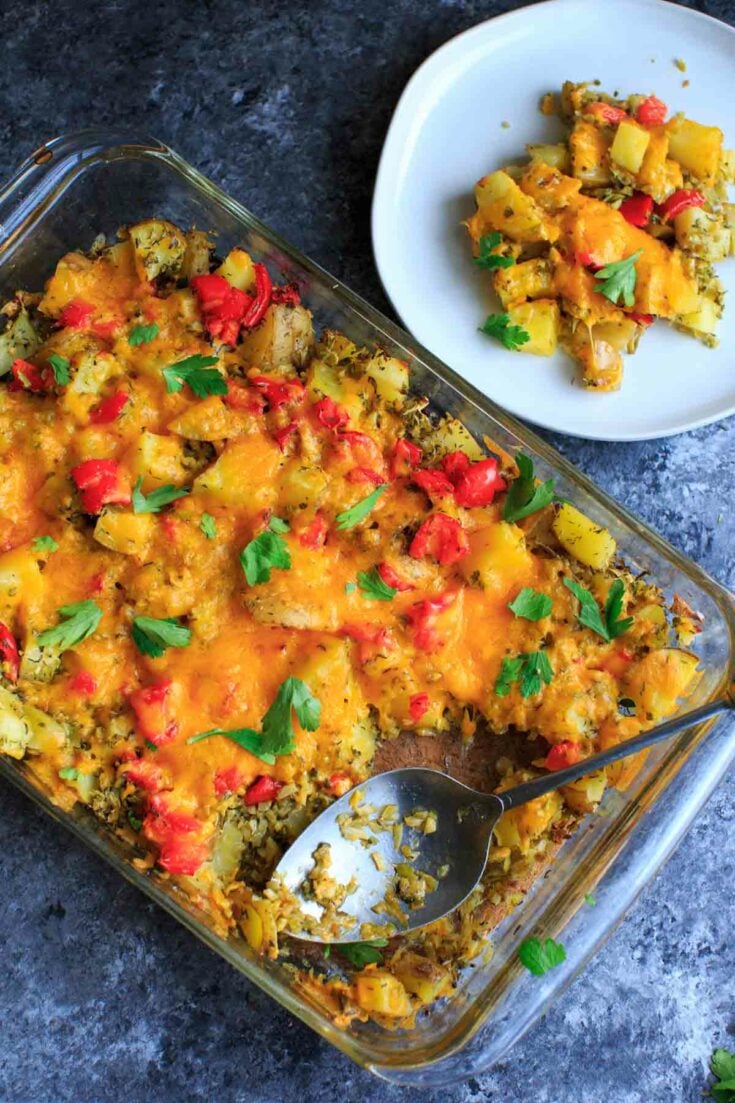 Broccoli and cheese baked potato casserole with parsley, with one plated serving