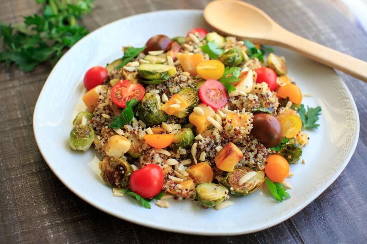 Fall Quinoa Salad on plate with a serving spoon