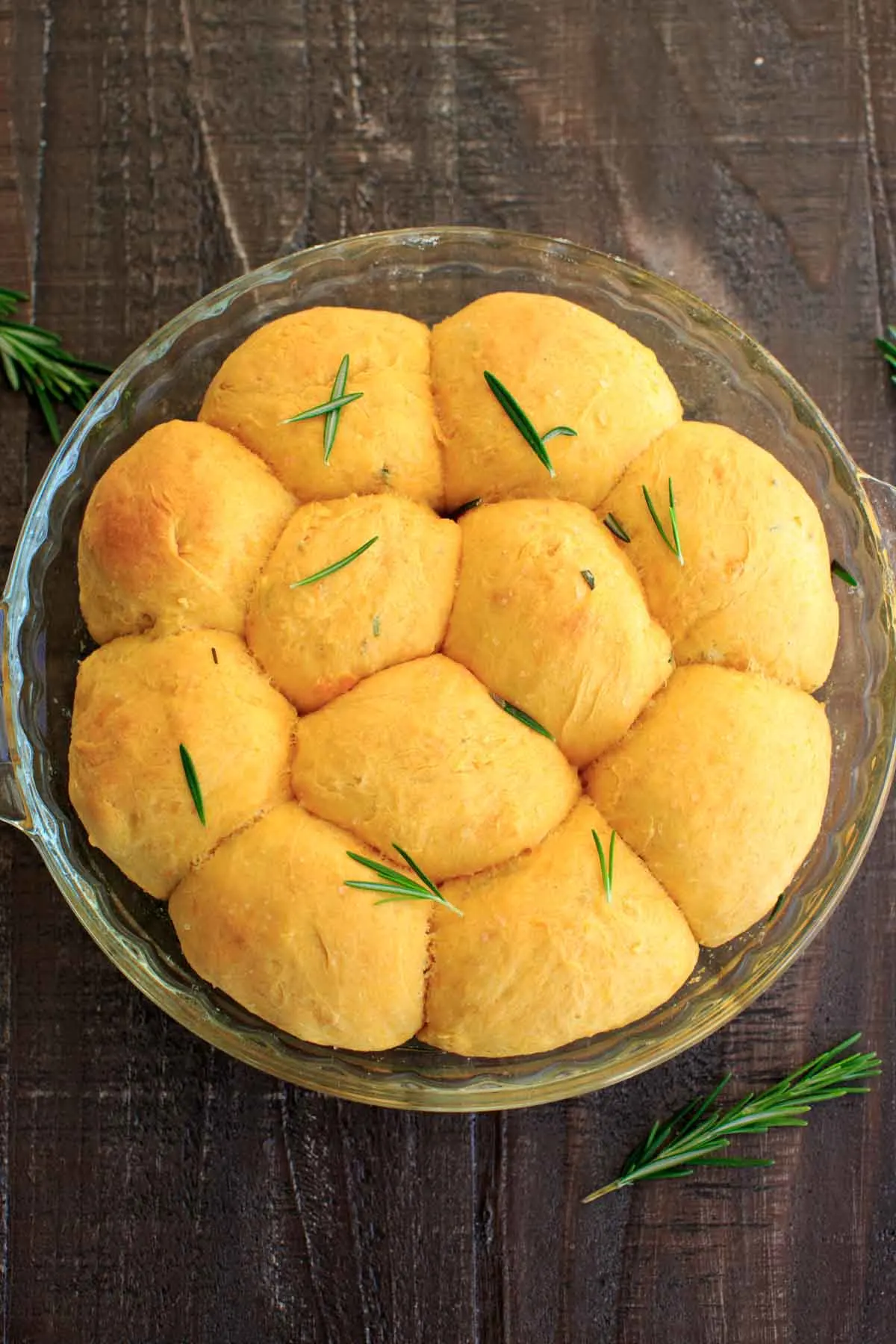 Rosemary Sweet Potato Dinner Rolls in glass baking dish