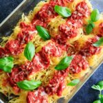 Spaghetti Squash Nests garnished with fresh basil are the perfect dinner appetizer for your guests. Customizable and delicious!