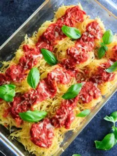 Spaghetti Squash Nests garnished with fresh basil are the perfect dinner appetizer for your guests. Customizable and delicious!