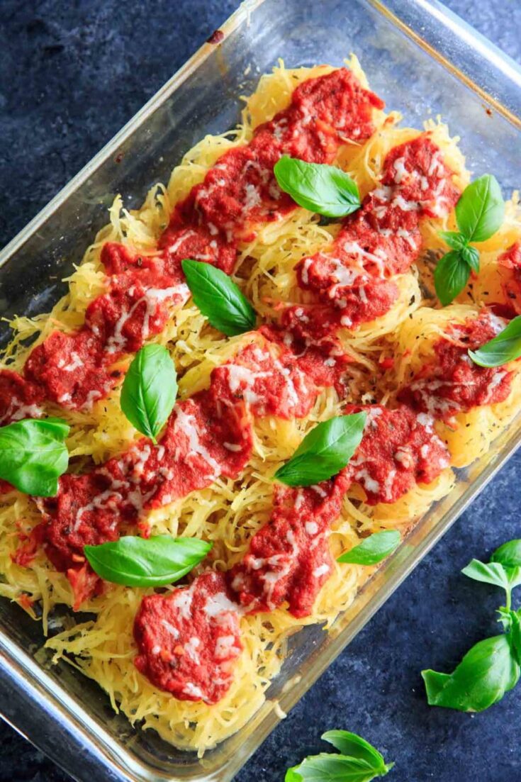 Spaghetti Squash Nests garnished with fresh basil are the perfect dinner appetizer for your guests. Customizable and delicious!