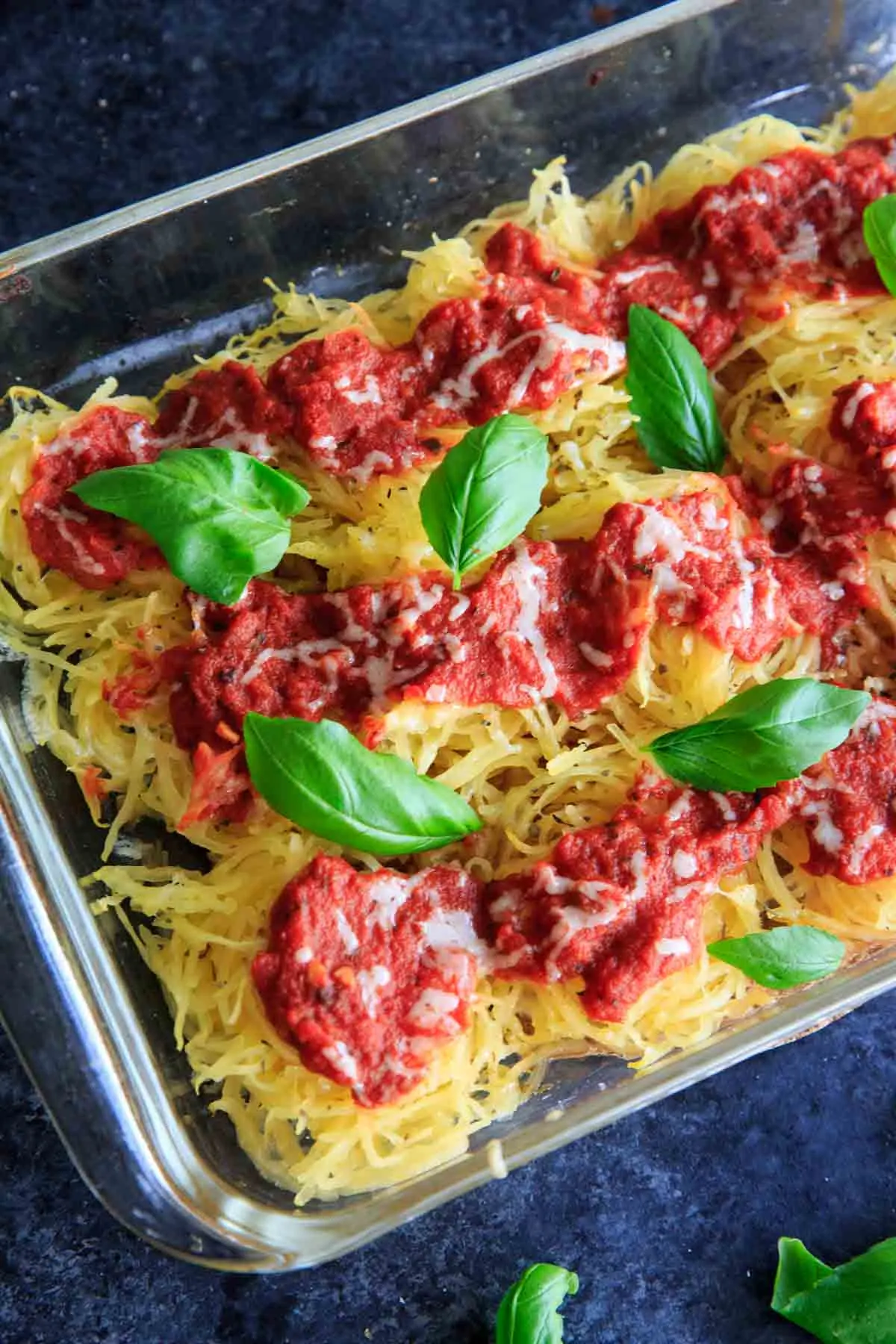 Spaghetti Squash Nests garnished with fresh basil are the perfect dinner appetizer for your guests. Customizable and delicious! Vegan-friendly and gluten-free.