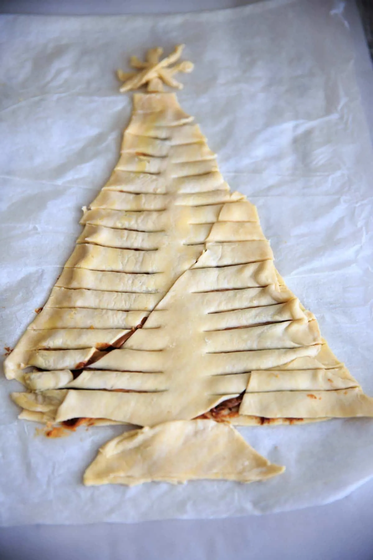 Cover with another layer of puff pastry and cut branches into pastry.