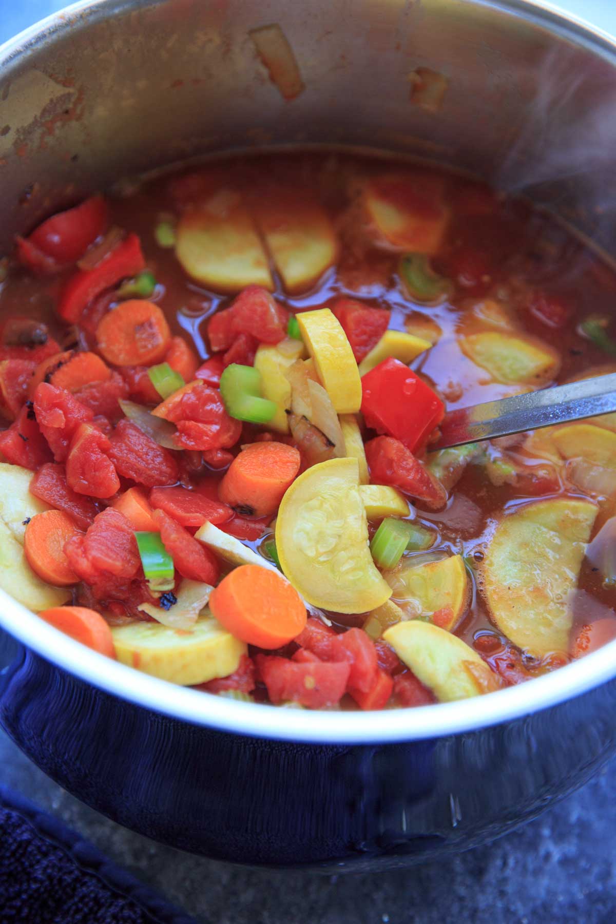detox cabbage soup with tomatoes and squash in pot