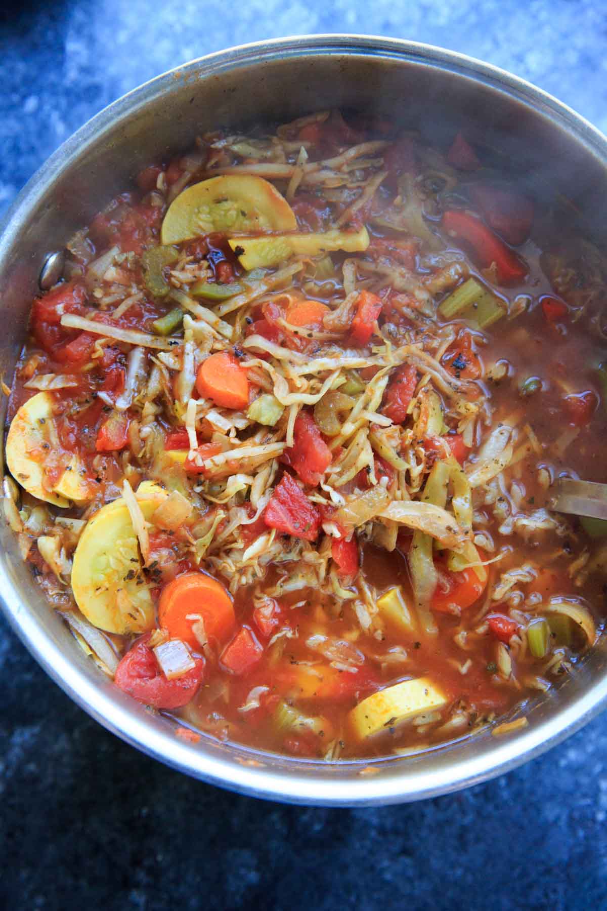 detox cabbage soup with tomatoes and squash in pot