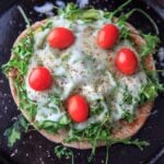 Quick and easy pita pizza recipe that you can make in the oven, microwave, or even on the grill! Fast lunch or dinner option that is completely customizable and faster than delivery.