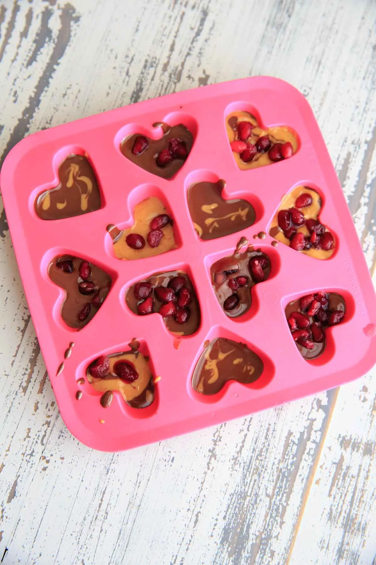 Chocolate Pomegranate Candy Recipe - melted chocolate peanut butter with pomegranate seeds