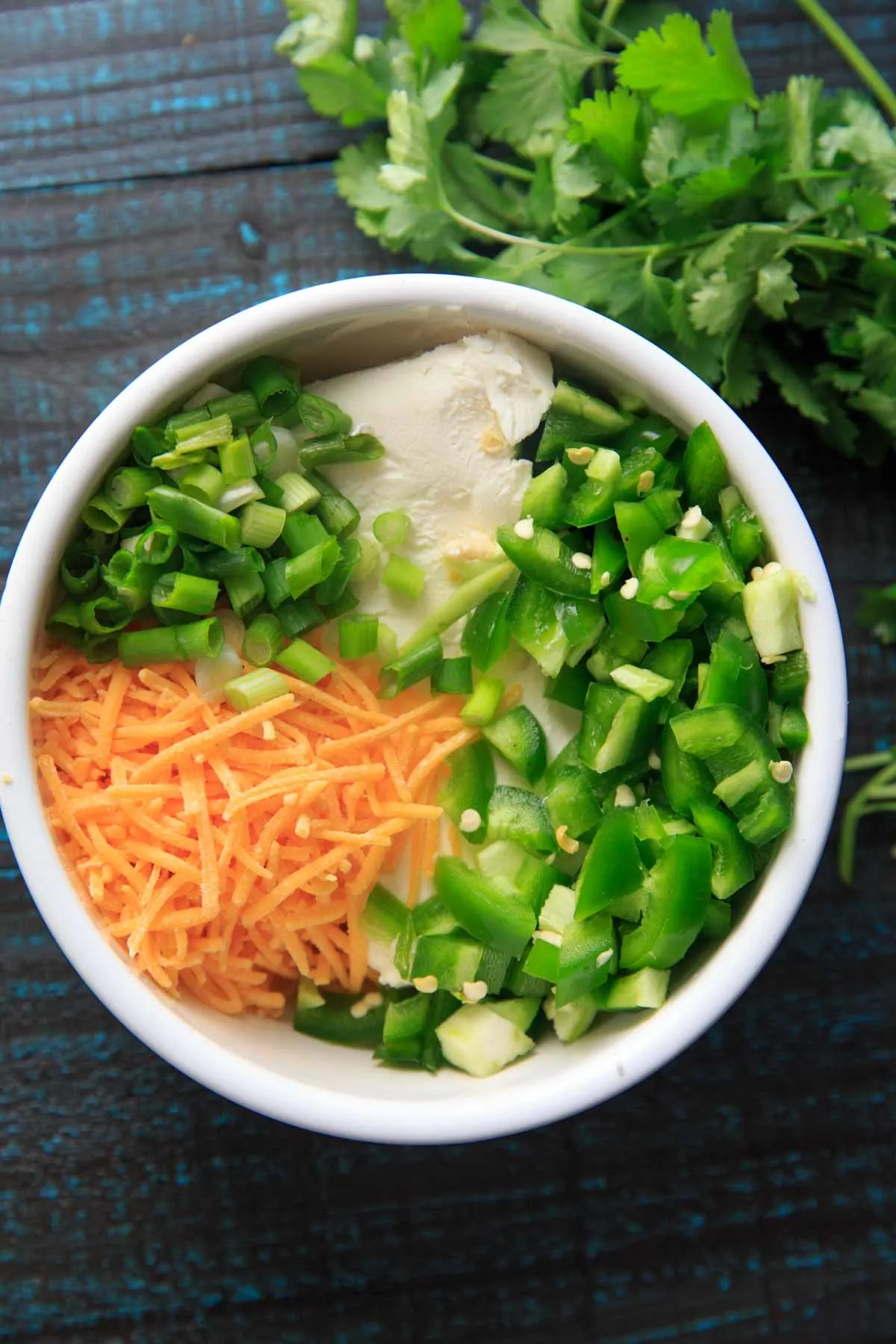 Jalapeno Popper Dip ingredients in a bowl before mixing