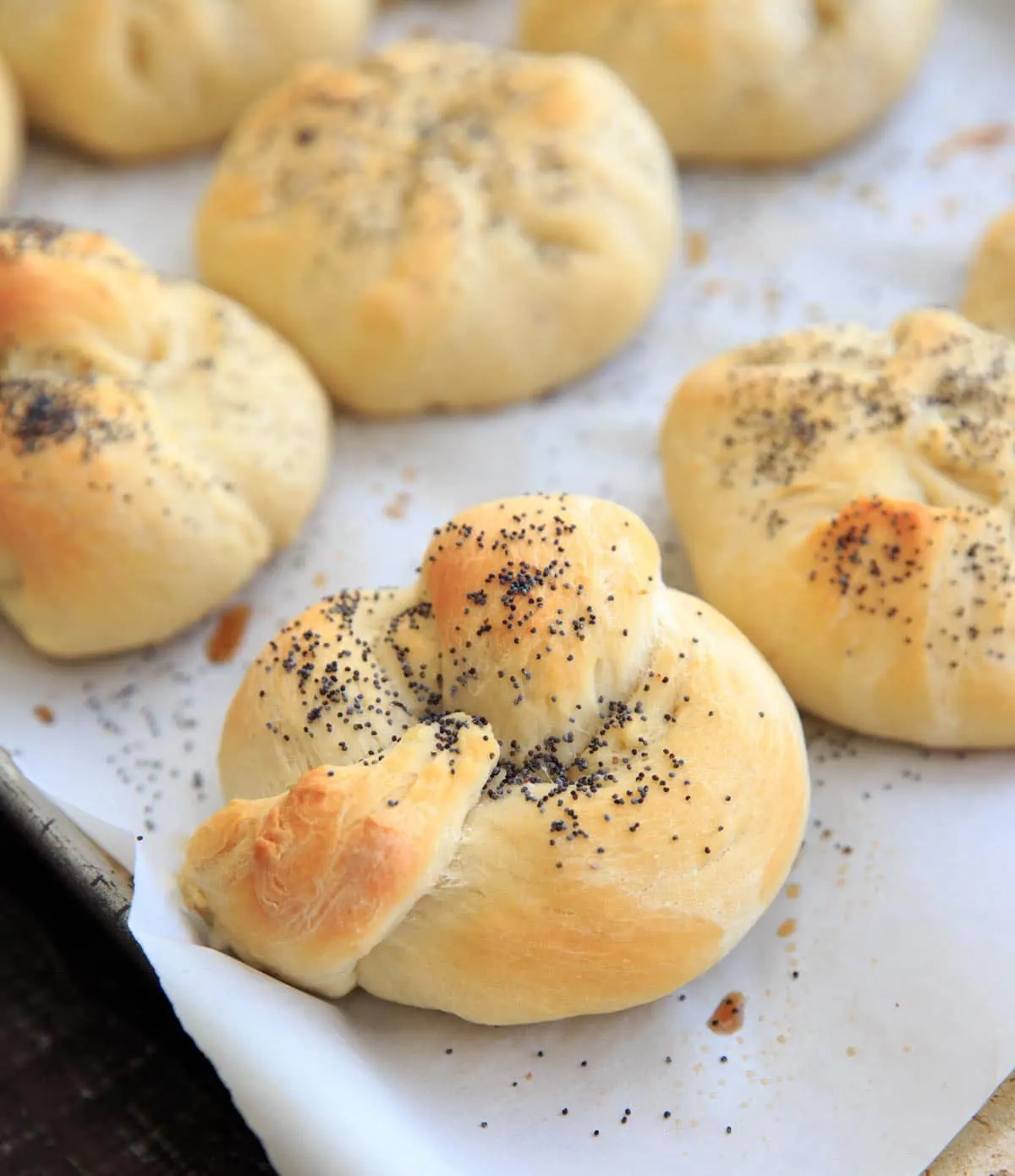 Homemade Kaiser Rolls Recipe - roll after baking with poppy seeds
