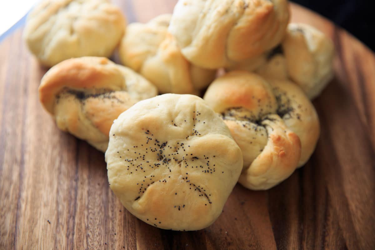 Homemade Kaiser Rolls Recipe - rolls after baking with poppy seeds horizontal