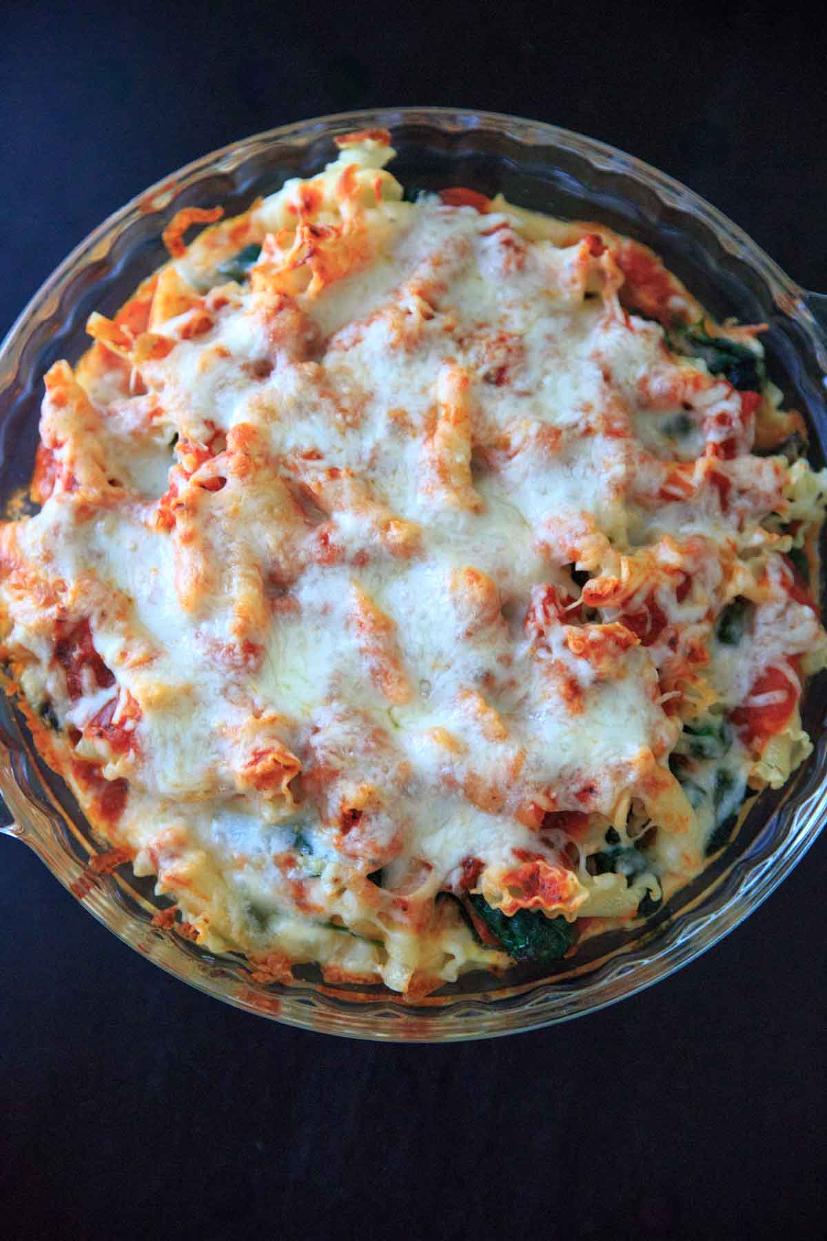 Spinach Baked Ziti Recipe - A meatless pasta casserole with greens that is sure to be a family favorite! Adapted from my grandma's baked ziti recipe and scaled down to 4 (generous) servings.