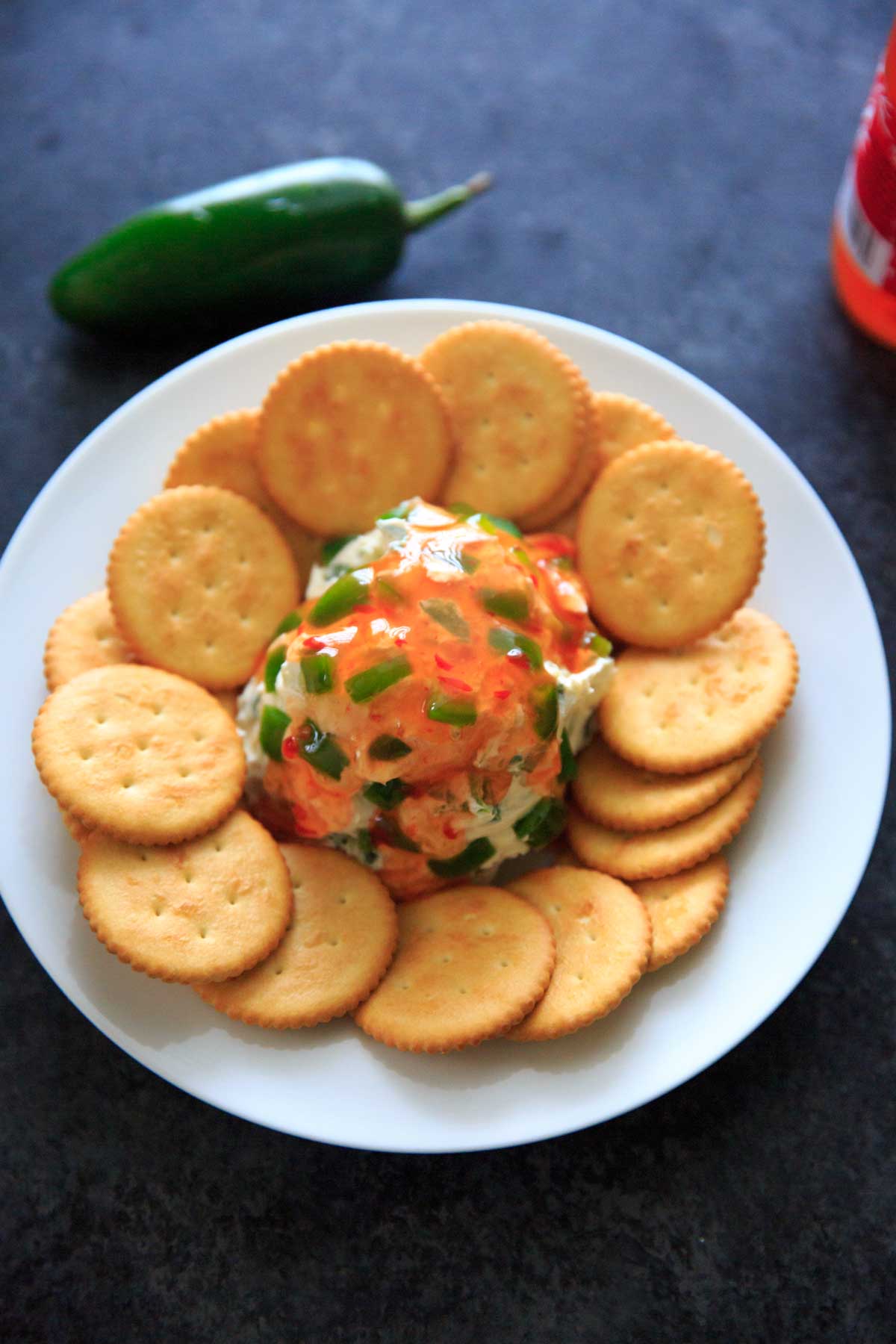 Sweet Chili Cream Cheese Dip - a super easy, 4 ingredient appetizer that is perfect for a party snack or sharable dip. Sweet and spicy and delicious!