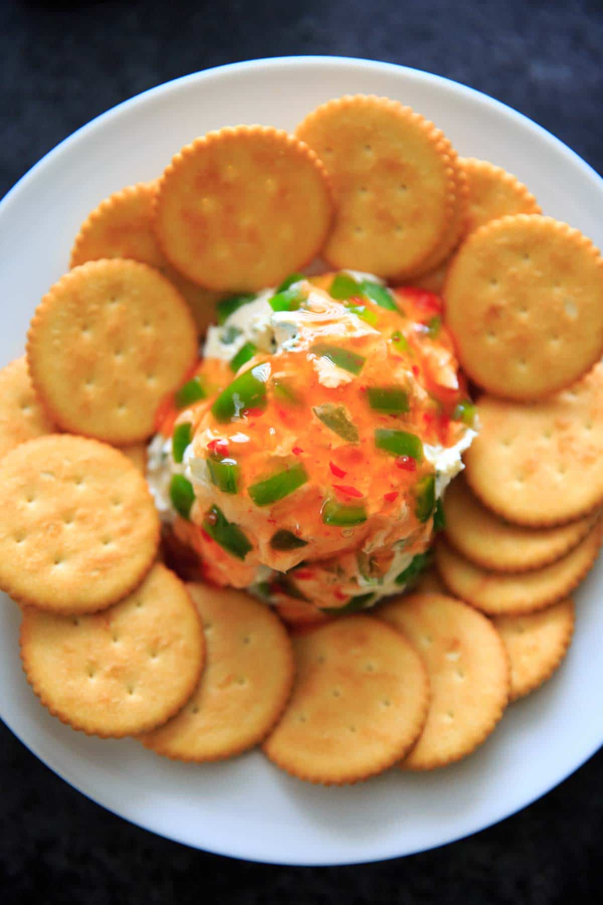 Sweet Chili Cream Cheese Dip - a super easy, 4 ingredient appetizer that is perfect for a party snack or sharable dip. Sweet and spicy and delicious!