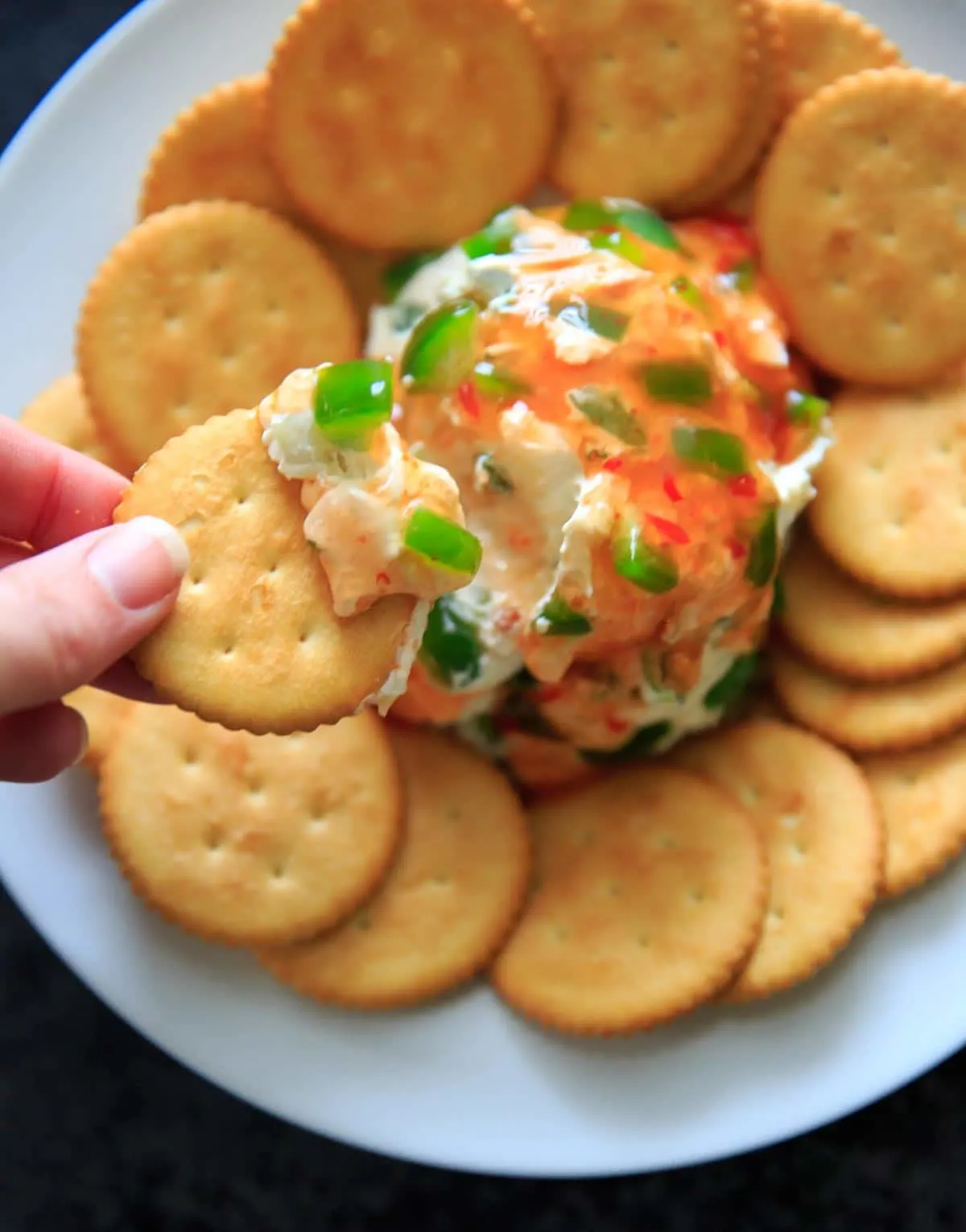 Sweet Chili Cream Cheese Dip - a super easy, 4 ingredient cheese ball appetizer that is perfect for a party snack or sharable dip. Sweet and spicy and delicious!