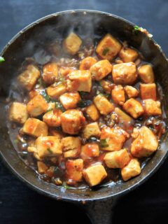 General Tso's Tofu cooking in a cast iron pan. Recipe from Chloe Flavor cookbook