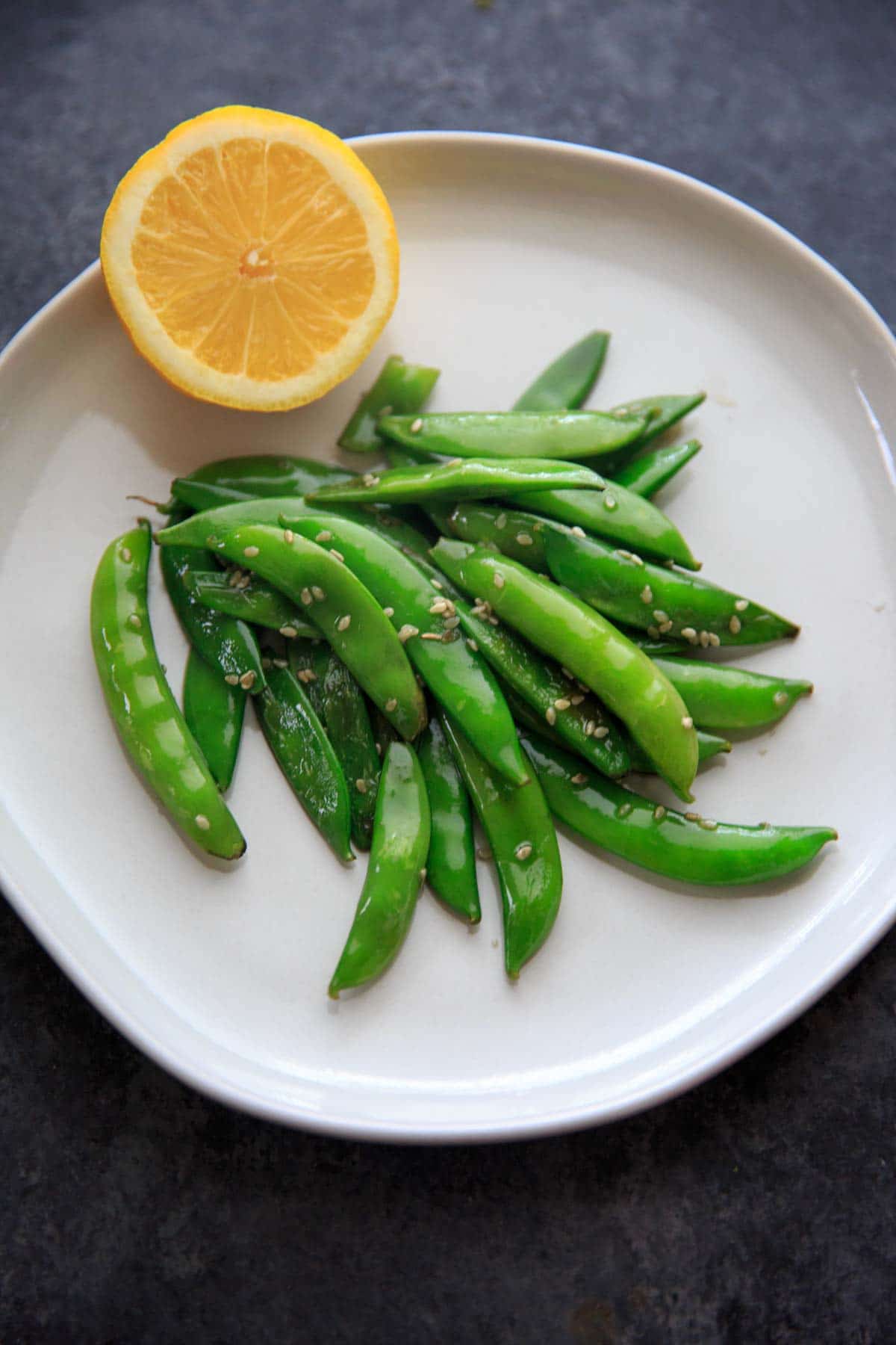 A citrusy and tasty vegetable side dish - Stir-fried Lemon Sesame Sugar Snap Peas! Eat as is for a side, add to pasta or salads.