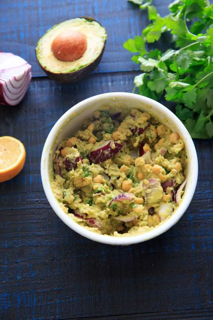 Smashed Avocado and Chickpea Salad in a bowl: picture with ingredients laid out