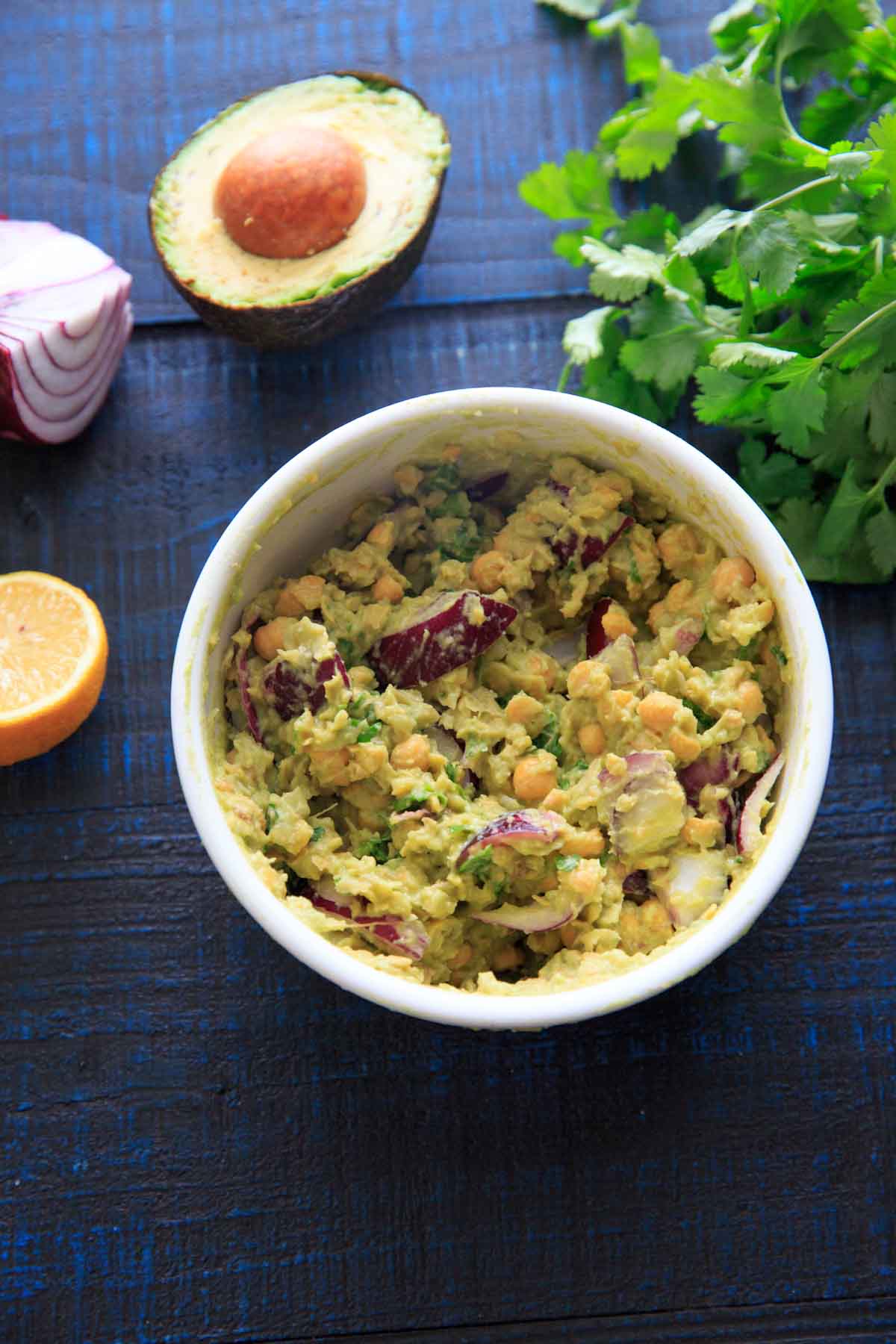 Smashed Avocado and Chickpea Salad in a bowl: picture with ingredients laid out