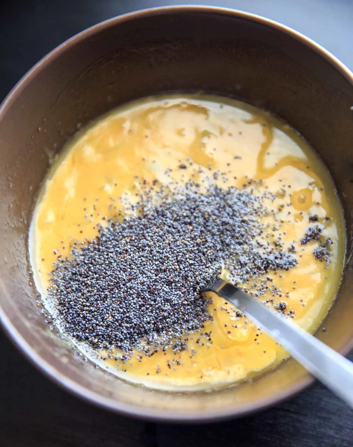 Melted butter with poppy seeds for Ham-less Swiss Cheese Hot Slider Sandwiches Recipe