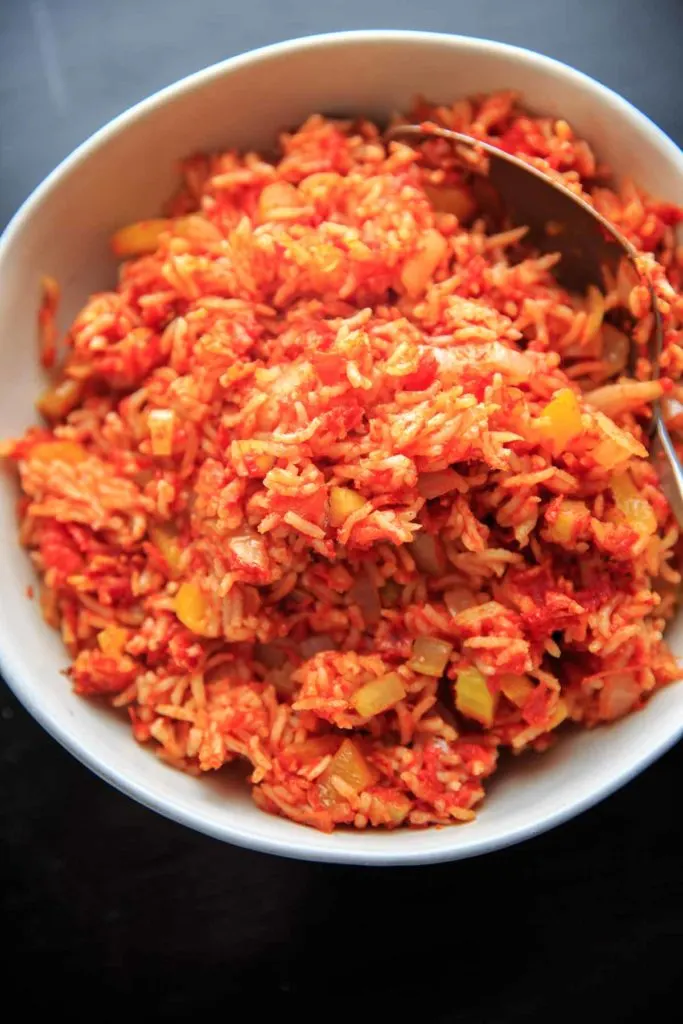 Nana's Spanish Rice recipe - a super easy, one pan / one pot side dish that takes only minutes to throw together. No need to pre-cook the rice!