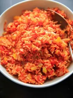 Nana's Spanish Rice recipe - a super easy, one pan / one pot side dish that takes only minutes to throw together. No need to pre-cook the rice! Naturally vegan and gluten-free.