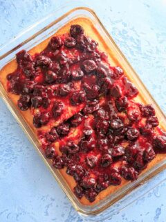 White Texas Sheet Cake with Cherry Glaze Topping. Perfect for a birthday cake or any cherry-lover, and those who don't like traditional frosting! Super easy recipe.