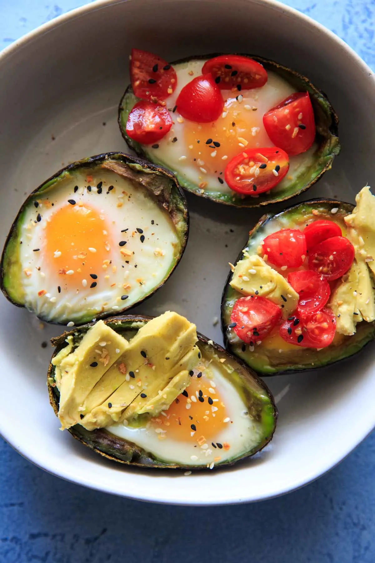 Baked Egg in Avocado's (Avocado "Nests") are a fun way to have a balanced snack or breakfast. Customizable with toppings and will last a day or two in the fridge, so you can bake ahead if needed! Low-carb, protein, fiber and healthy fats.