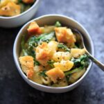 White Cheddar Macaroni and Cheese with Spinach and "Everything Bagel" Seasoned croutons. A delicious and unique spin on mac and cheese that comes together surprisingly quickly - in under 30 minutes! This flavorful combo sneaks in veggies and is sure to be added to your meatless dinner rotation.