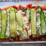 Layering the zucchini noodles on the lasagna