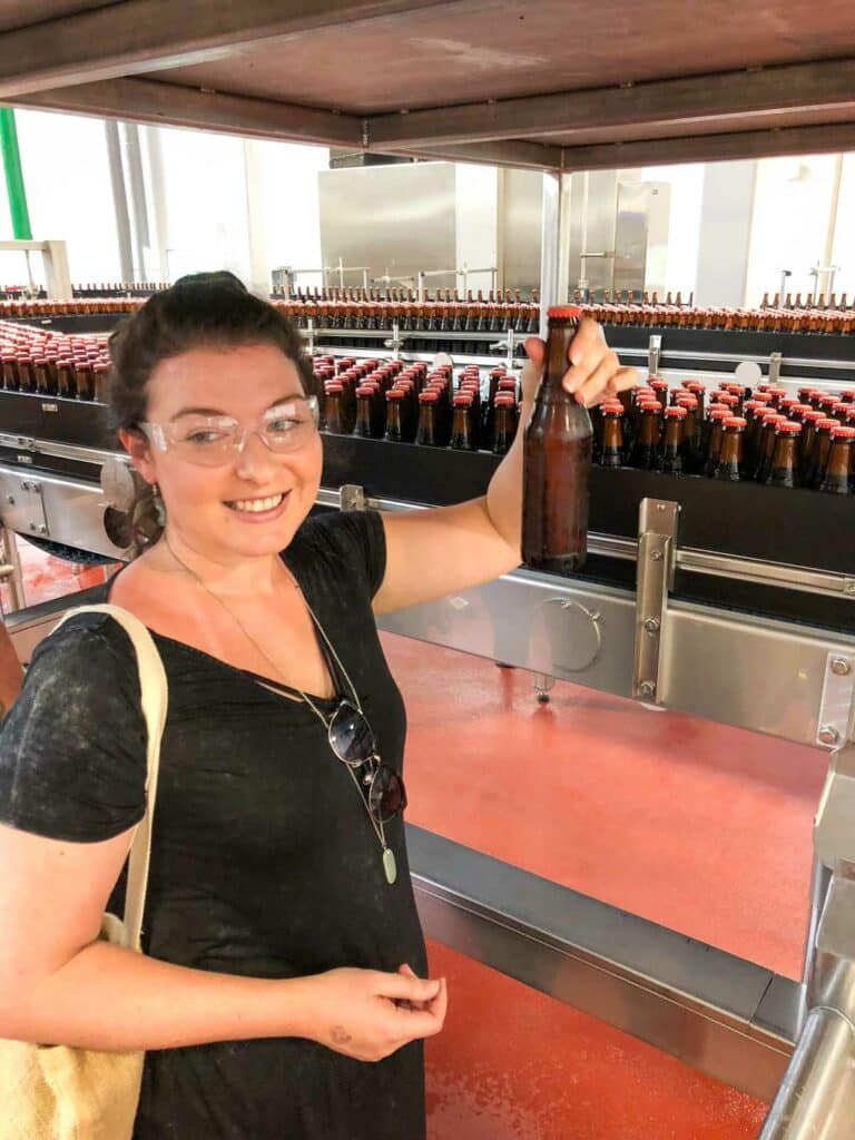 New Belgium Brewery tour - picking a beer off the line