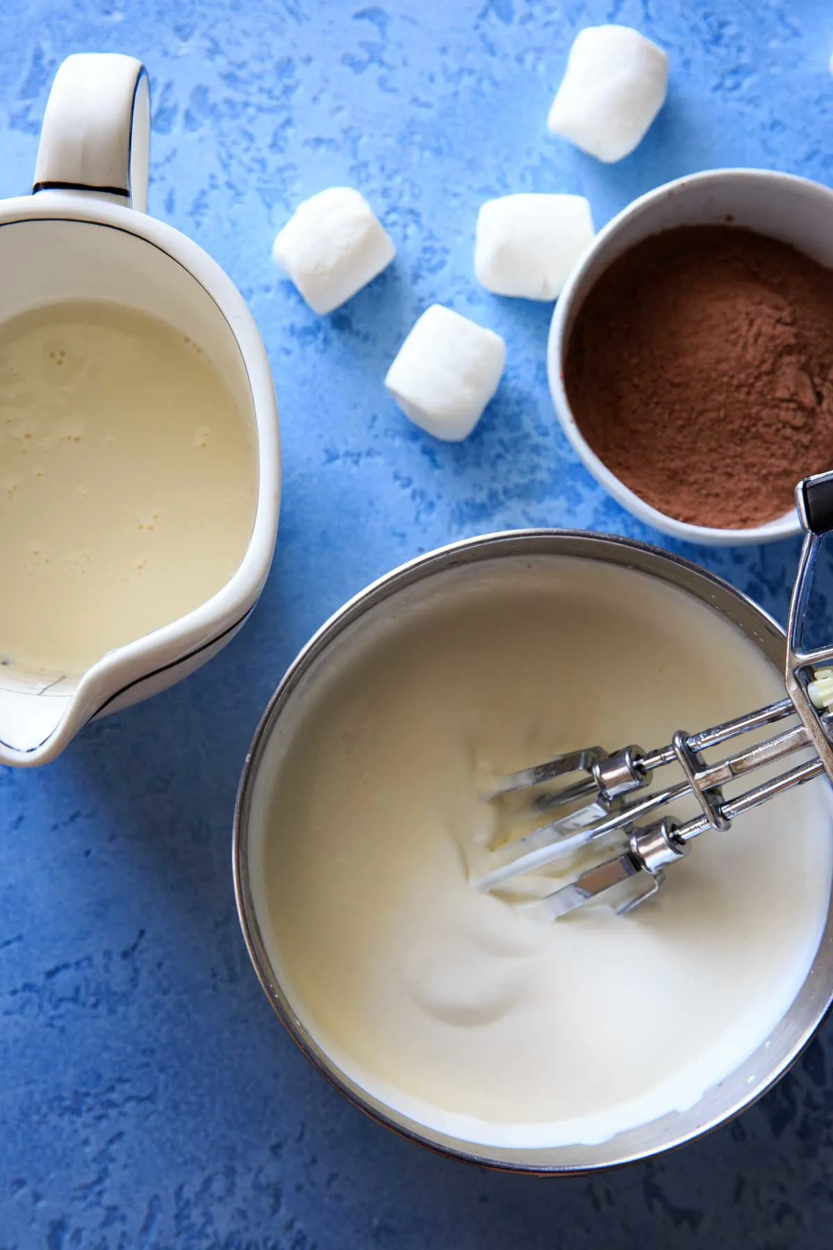 Hot Chocolate Ice Cream ingredients - homemade sweetened condensed milk, whipped whipping cream and hot chocolate mix