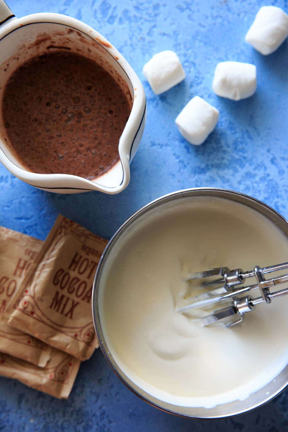 Hot Chocolate Ice Cream ingredients - homemade sweetened condensed milk, whipped whipping cream and hot chocolate mix