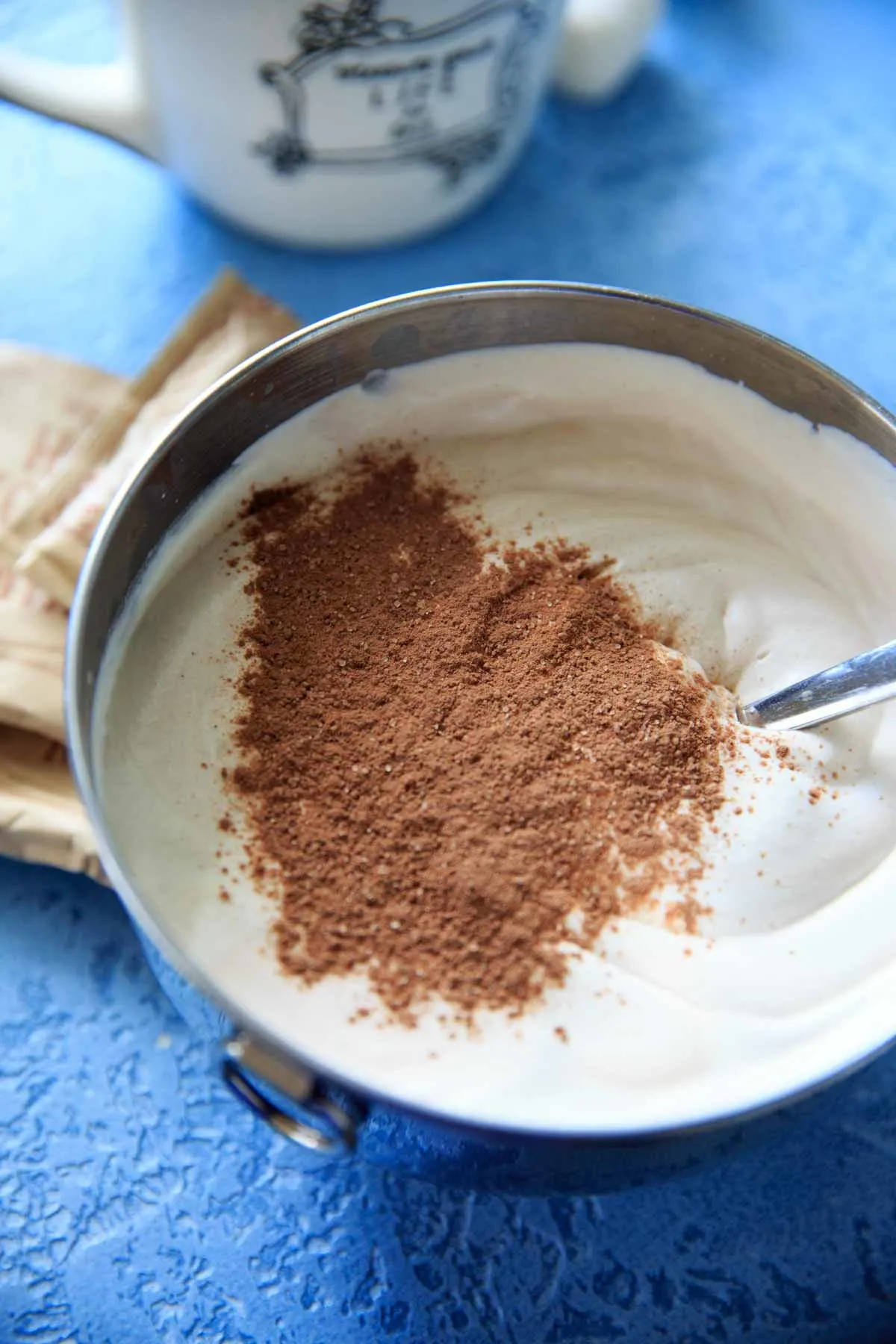 Hot cocoa powder in whipped whipping cream